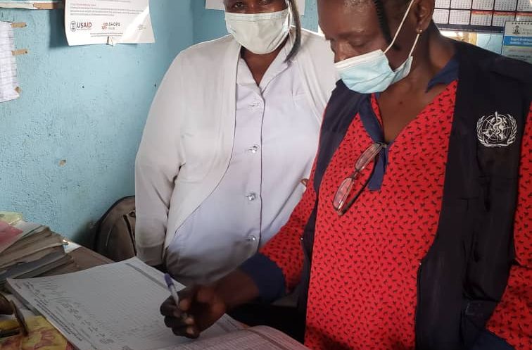 Lucy conducting a Data Quality Check for routine immunization & COVID-19 vaccination at Jarmai Primary Health Care in  Dengi Ward