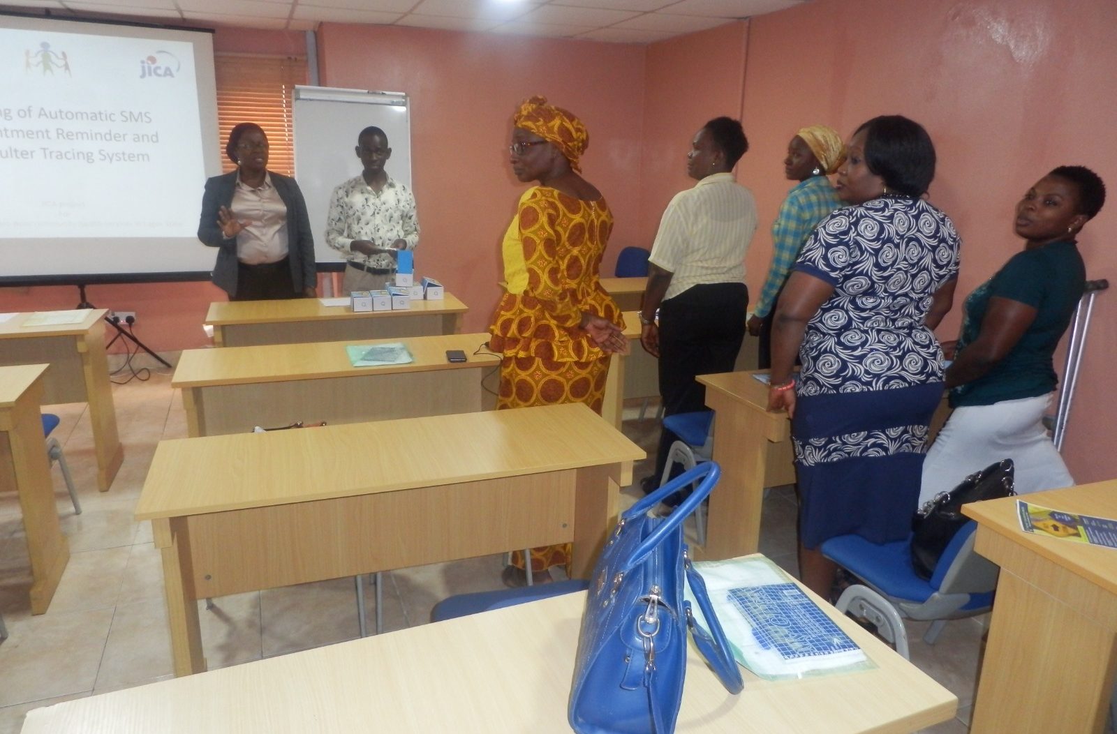 Implementers and Immunization officers discussing how to navigate the Defaulter Tracking Dashboard